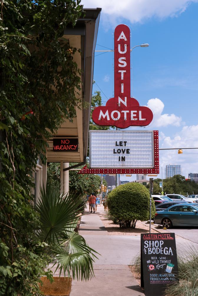 A sign on the Austin Motel that says 'Let Love In'